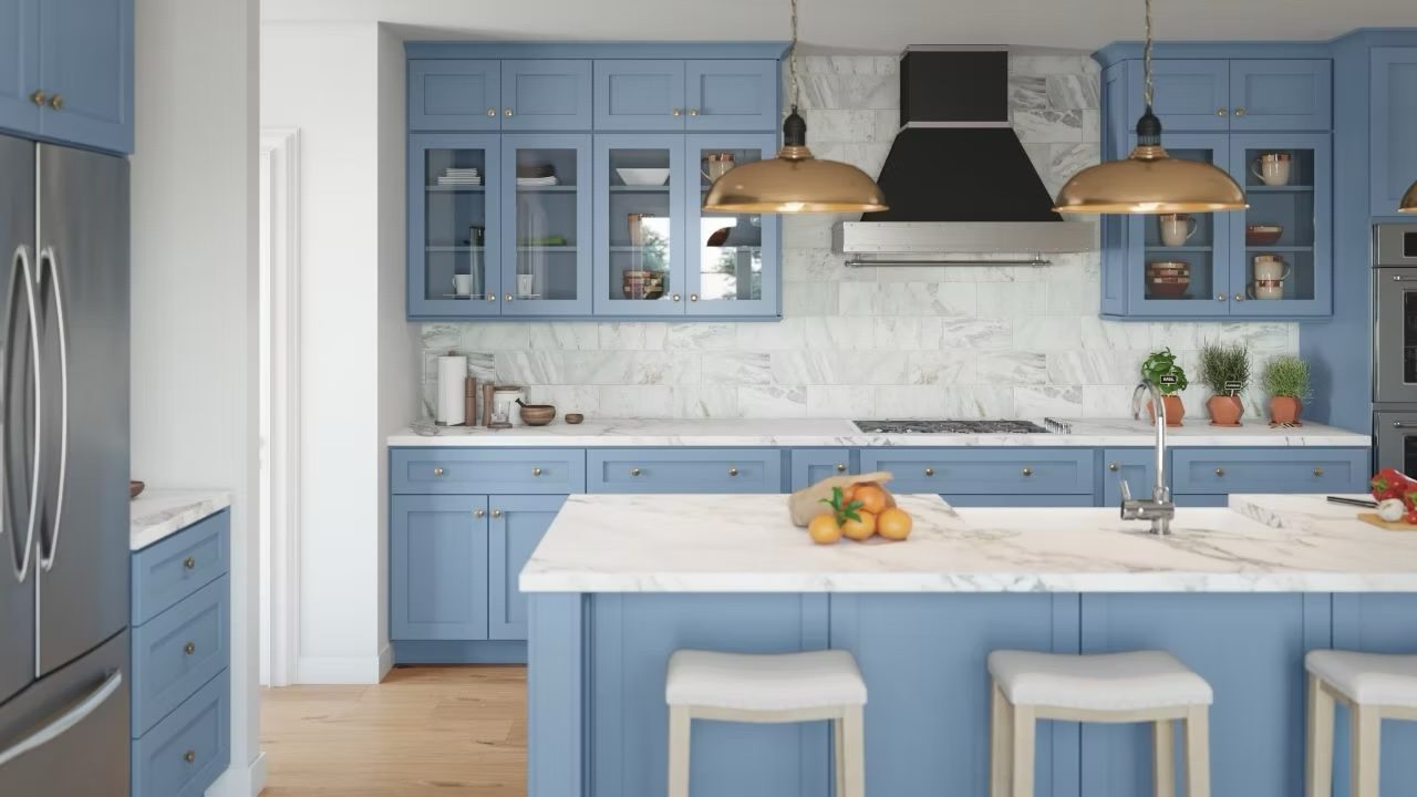 Blue shaker kitchen cabinets with white island from the Forevermark line carried by Division Seven Millwork